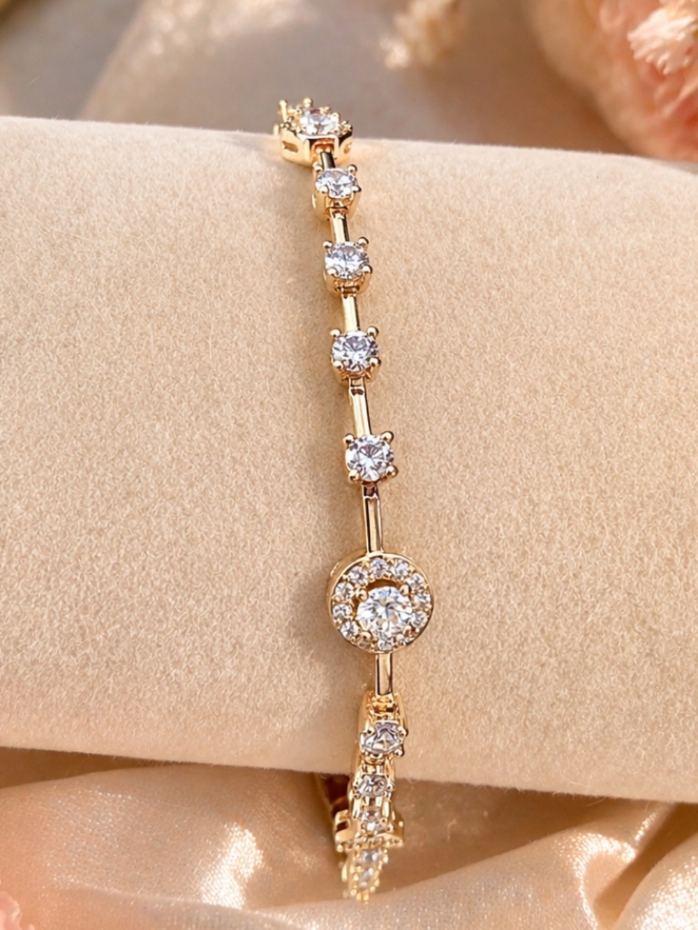 Gold bracelet with AAA rated CZ stones and halo accent, up to 8 inches